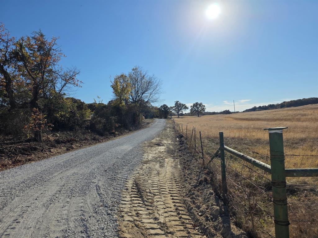 0 Holland Road Forestburg, TX 76239 - Photo 15 of 39 a view of a lake with beach in background