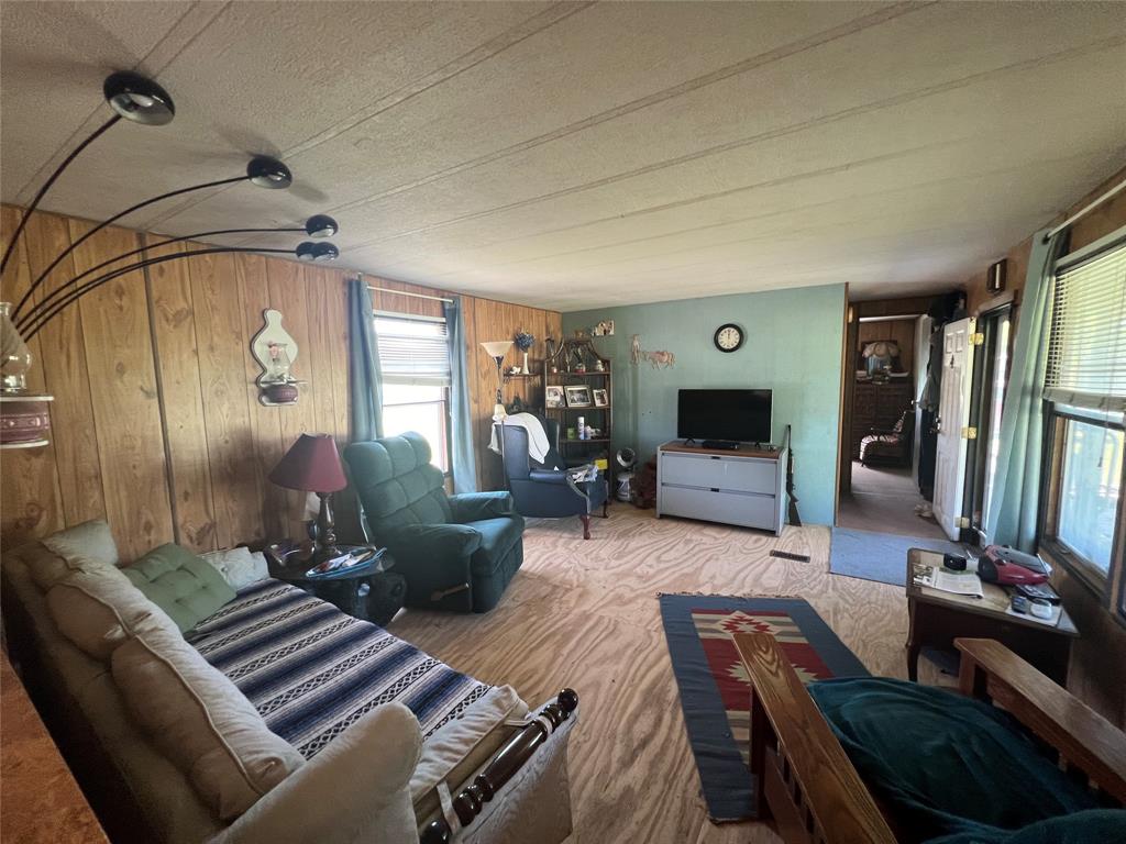 0 Holland Road Forestburg, TX 76239 - Photo 28 of 39 a living room with furniture and a flat screen tv