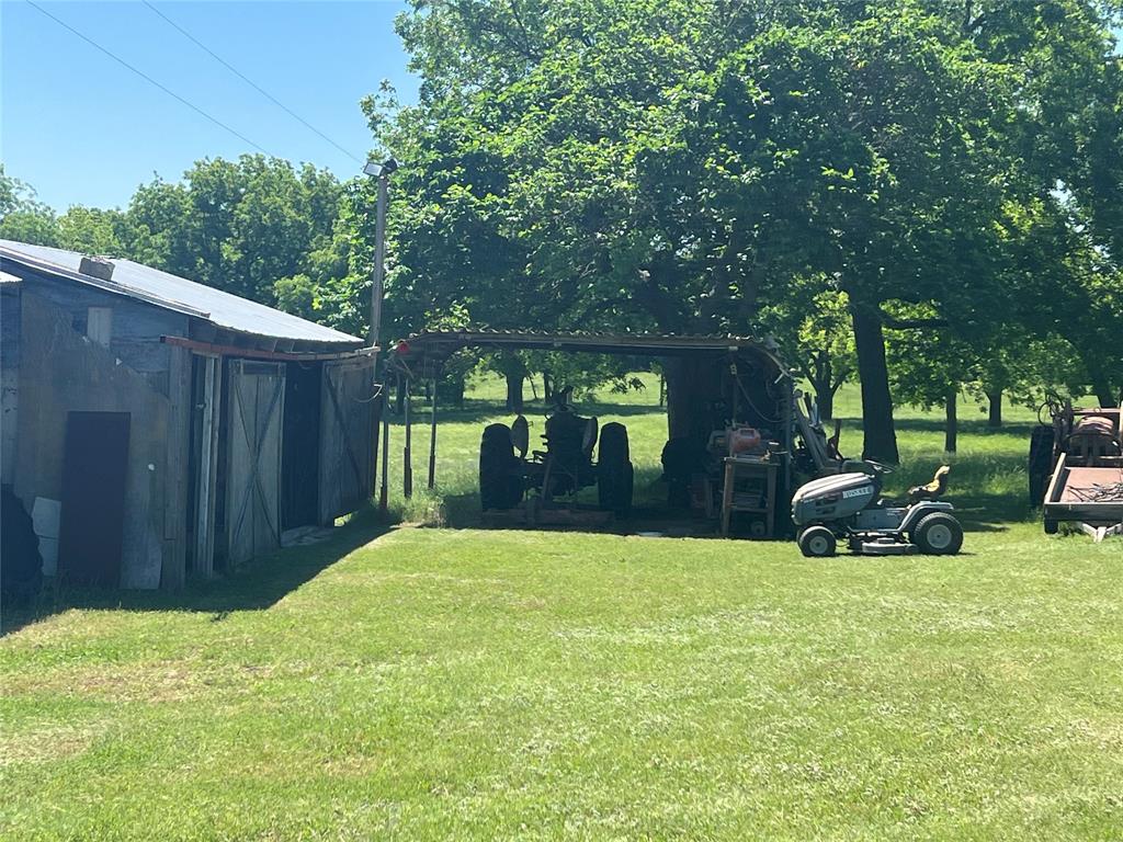 0 Holland Road Forestburg, TX 76239 - Photo 32 of 39 a view of a backyard with a sitting area and slide