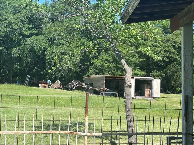 a view of a lake with a yard