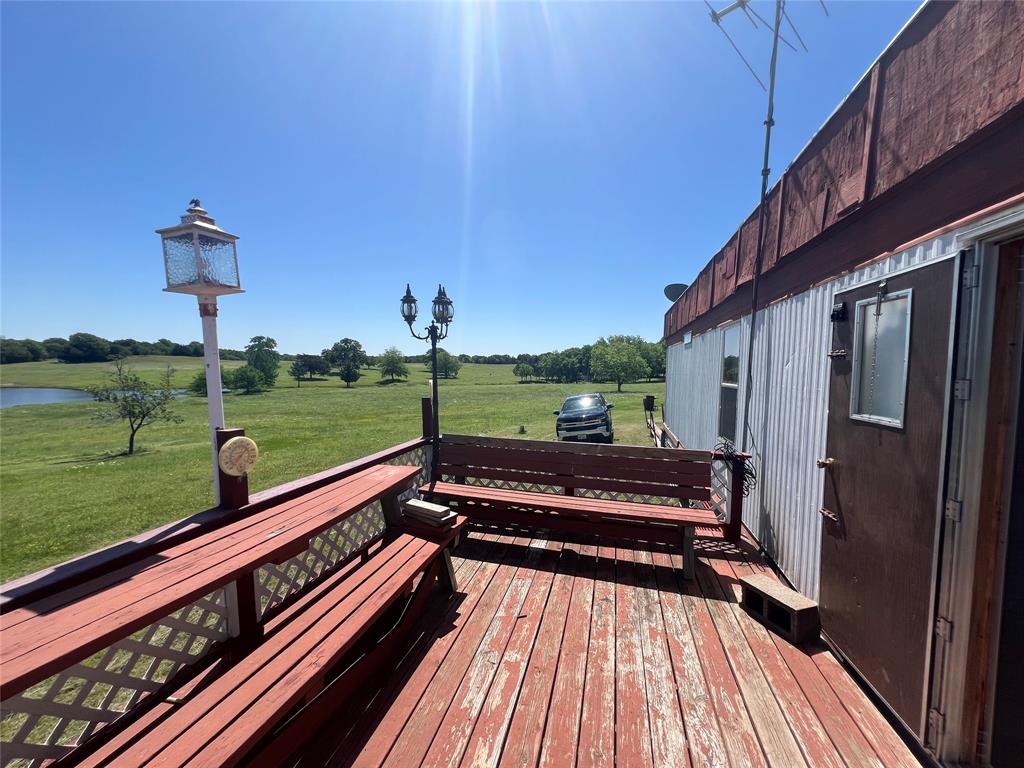 0 Holland Road Forestburg, TX 76239 - Photo 7 of 39 a view of a wooden deck with a bench