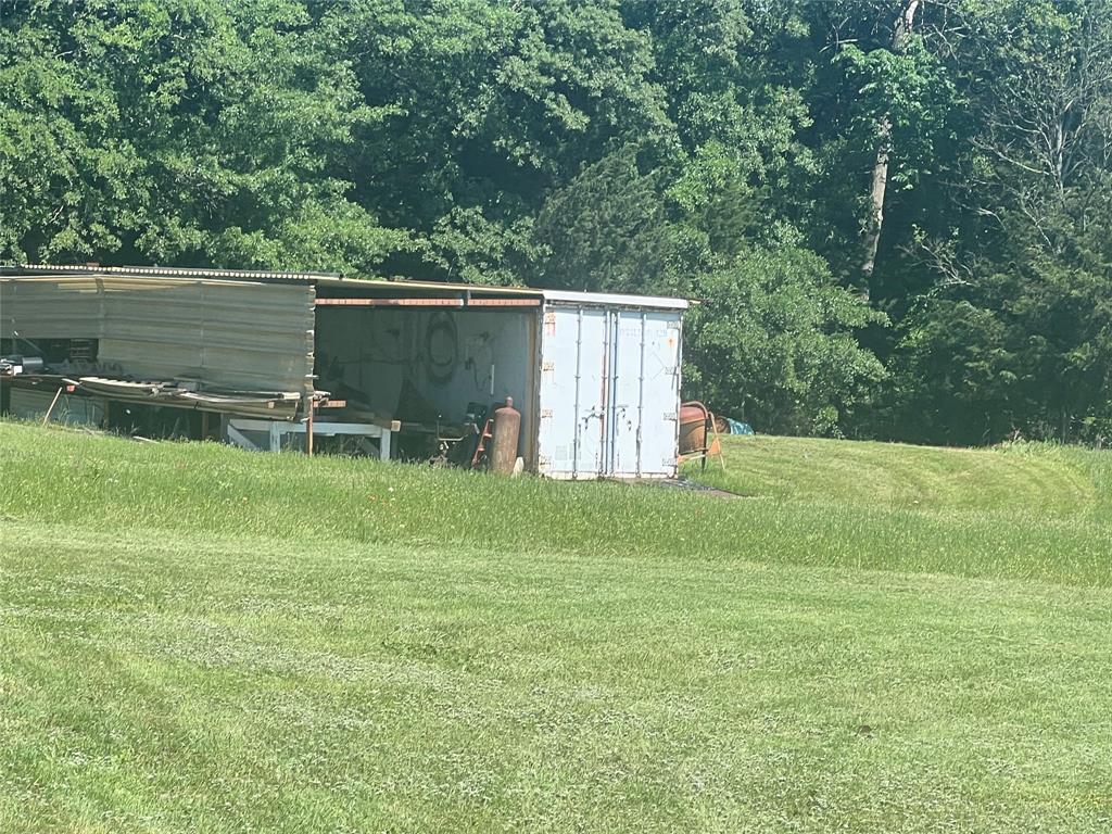 0 Holland Road Forestburg, TX 76239 - Photo 10 of 39 a backyard of a house with table and chairs