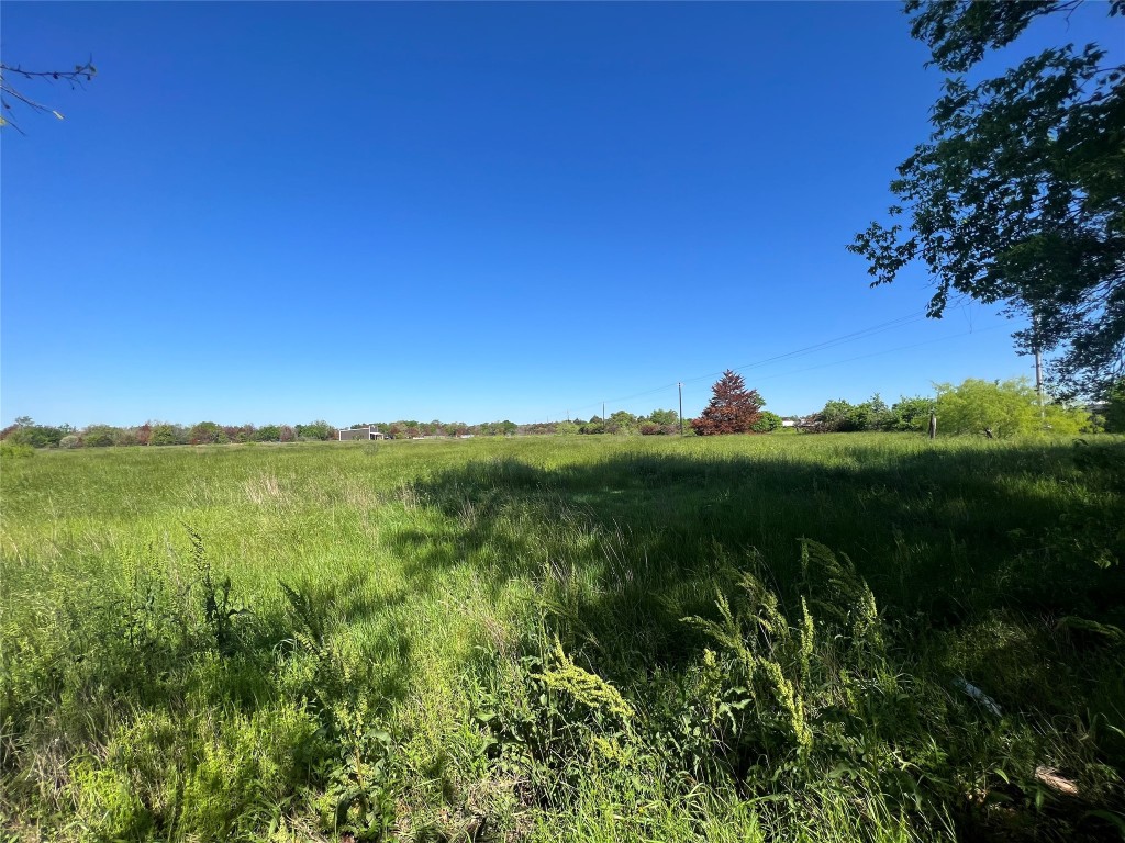 9203 Highway 21 Bryan, TX 77808 - Photo 2 of 8 a view of a lake and green valley