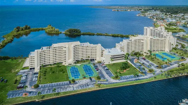 a view of a lake with tall building