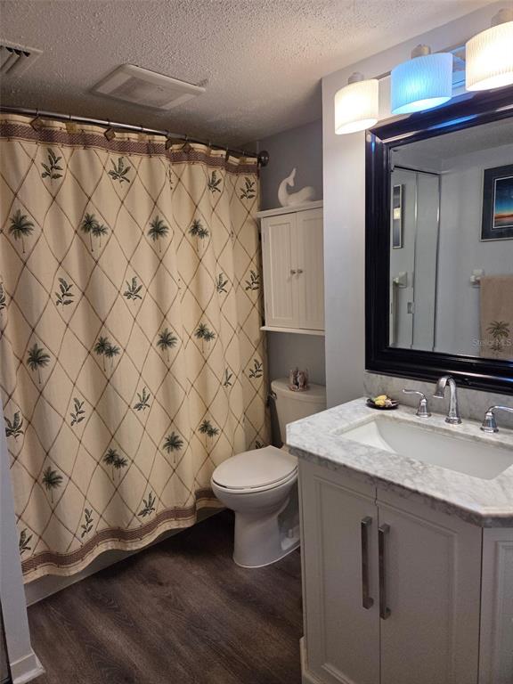 6035 Sea Ranch Drive, Unit 505 Hudson, FL 34667 - Photo 31 of 44 a bathroom with a sink and a toilet