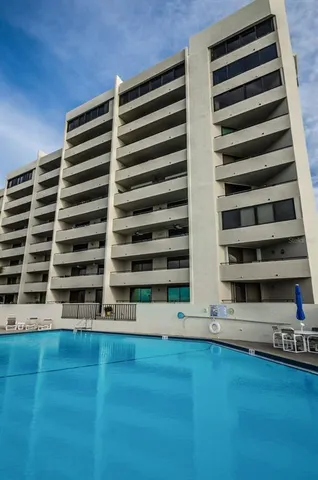 a view of a swimming pool with a terrace