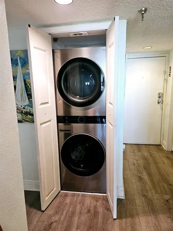 a view of a hallway with washer and dryer