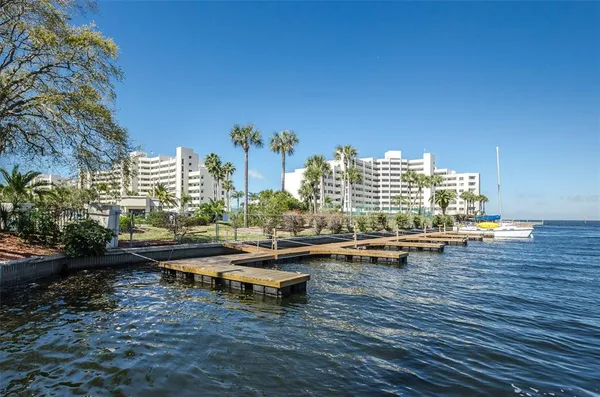 a view of a lake with tall building