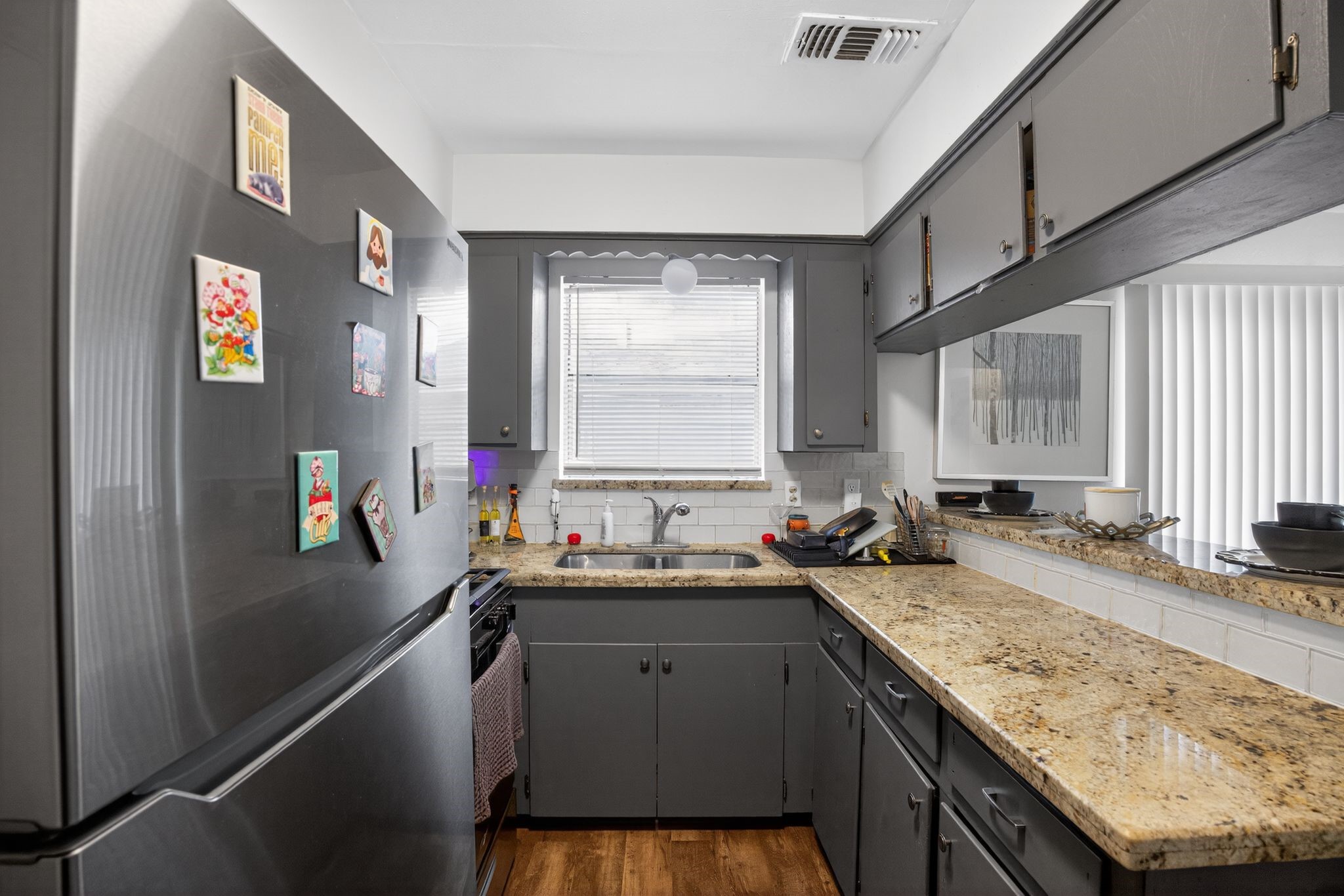 910 McLeary Street Houston, TX 77020 - Photo 7 of 23 a kitchen with a sink stove and cabinets