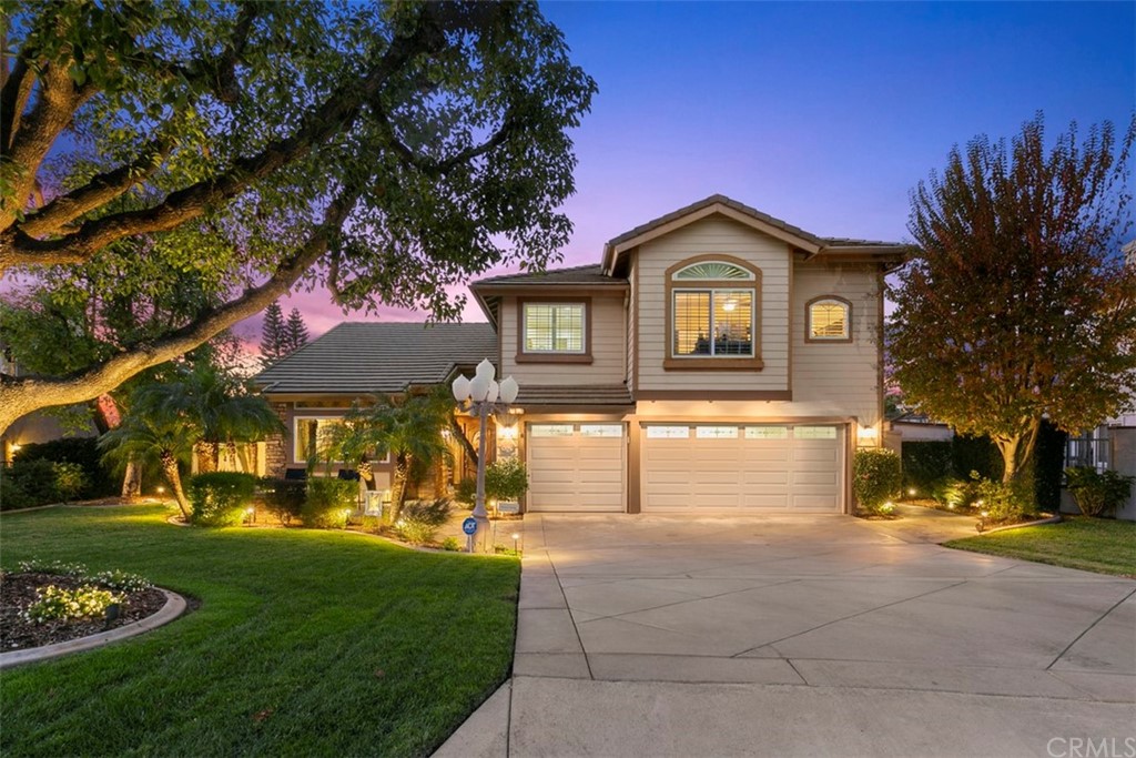 16134 Promontory Road Chino Hills, CA 91709 - Photo 1 of 1 a front view of a house with a yard and garage
