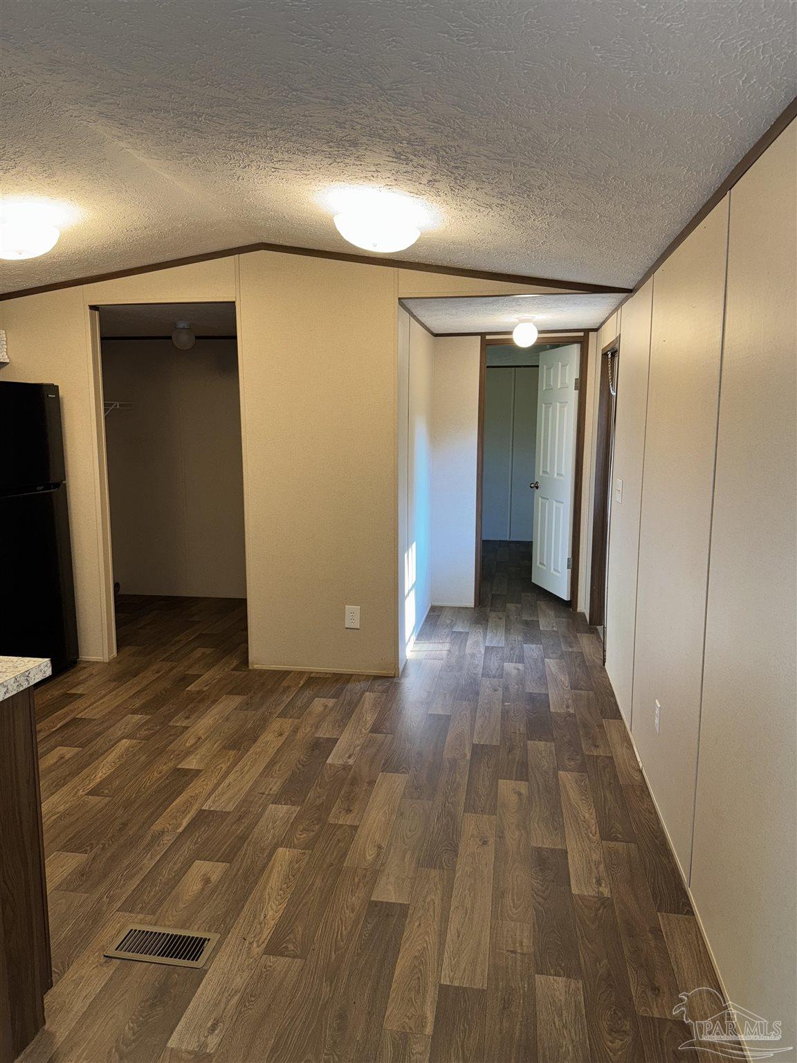 5049 Bent Tree Road Milton, FL 32583 - Photo 16 of 34 a view of hallway with wooden floor