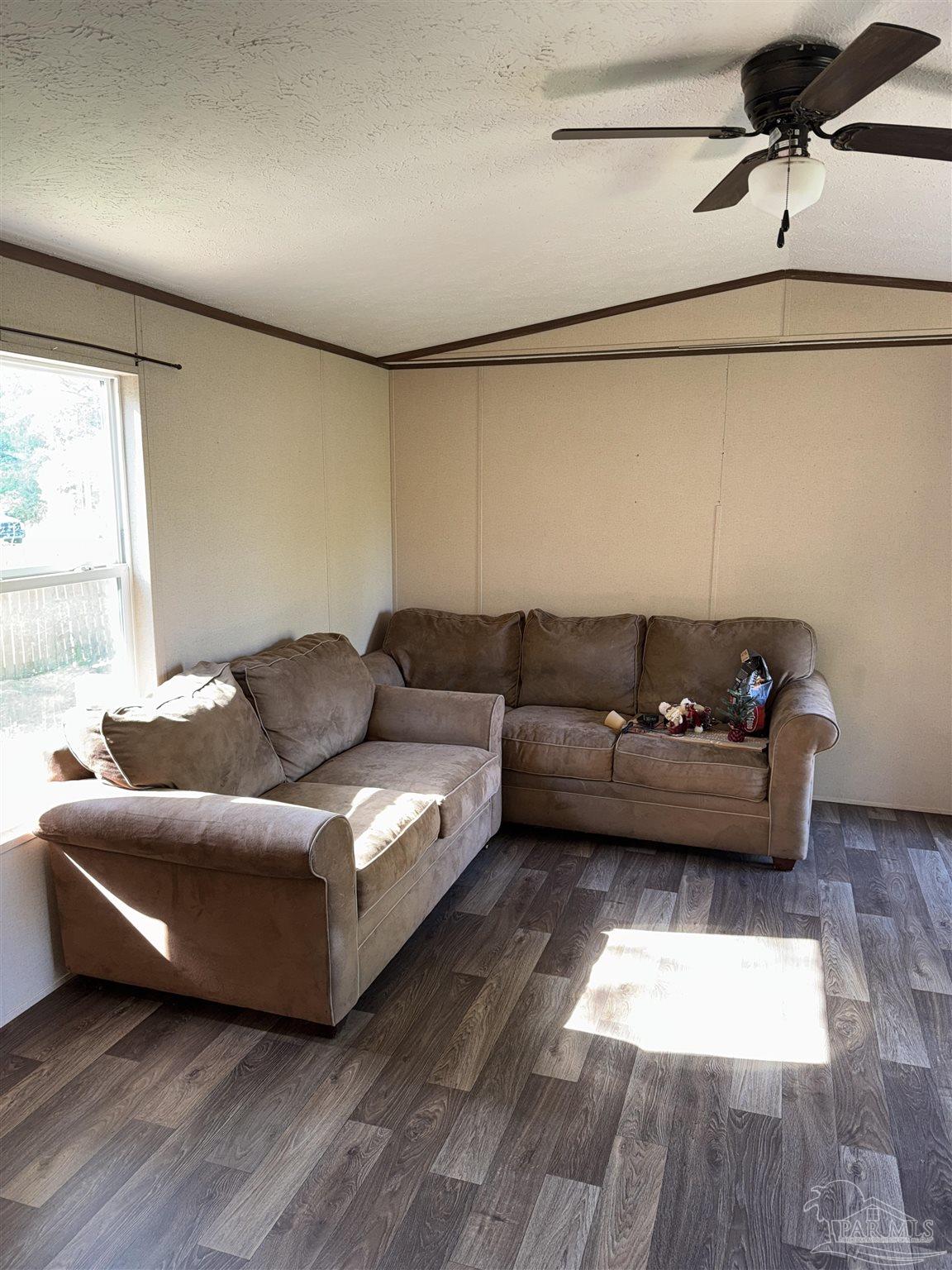 5049 Bent Tree Road Milton, FL 32583 - Photo 17 of 34 a living room with furniture and a window