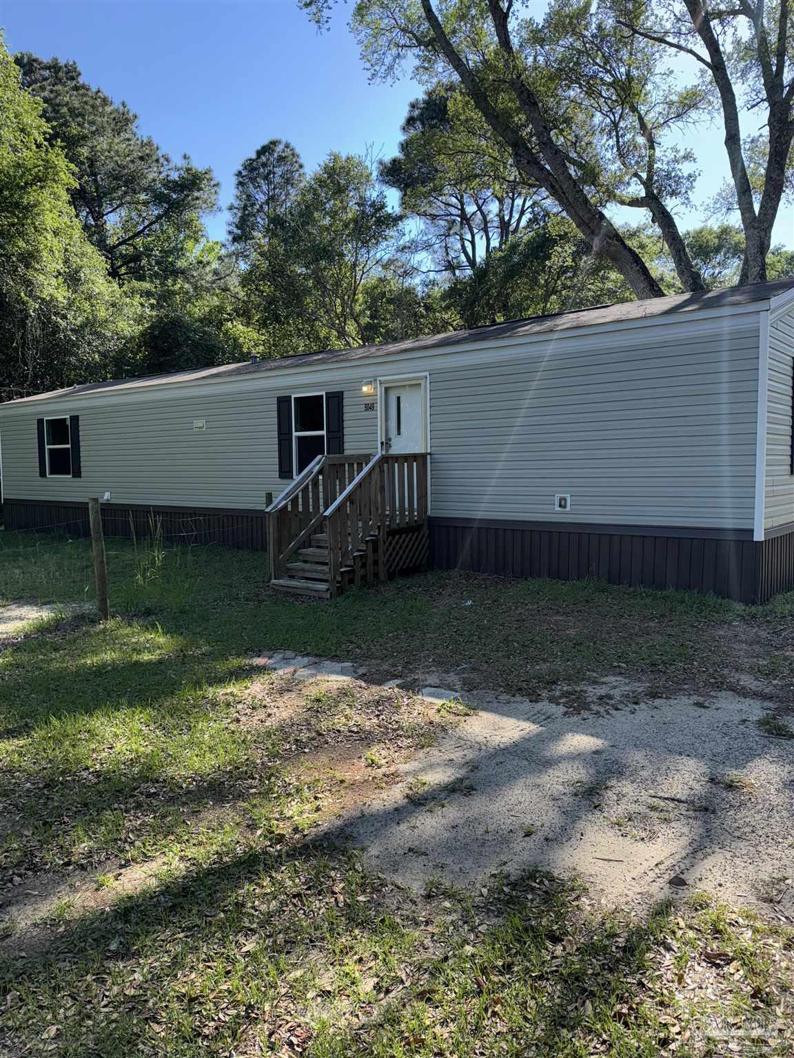 5049 Bent Tree Road Milton, FL 32583 - Photo 2 of 34 a view of a backyard