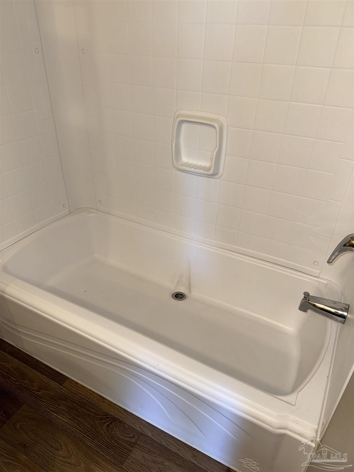 5049 Bent Tree Road Milton, FL 32583 - Photo 26 of 34 a bathroom with bathtub