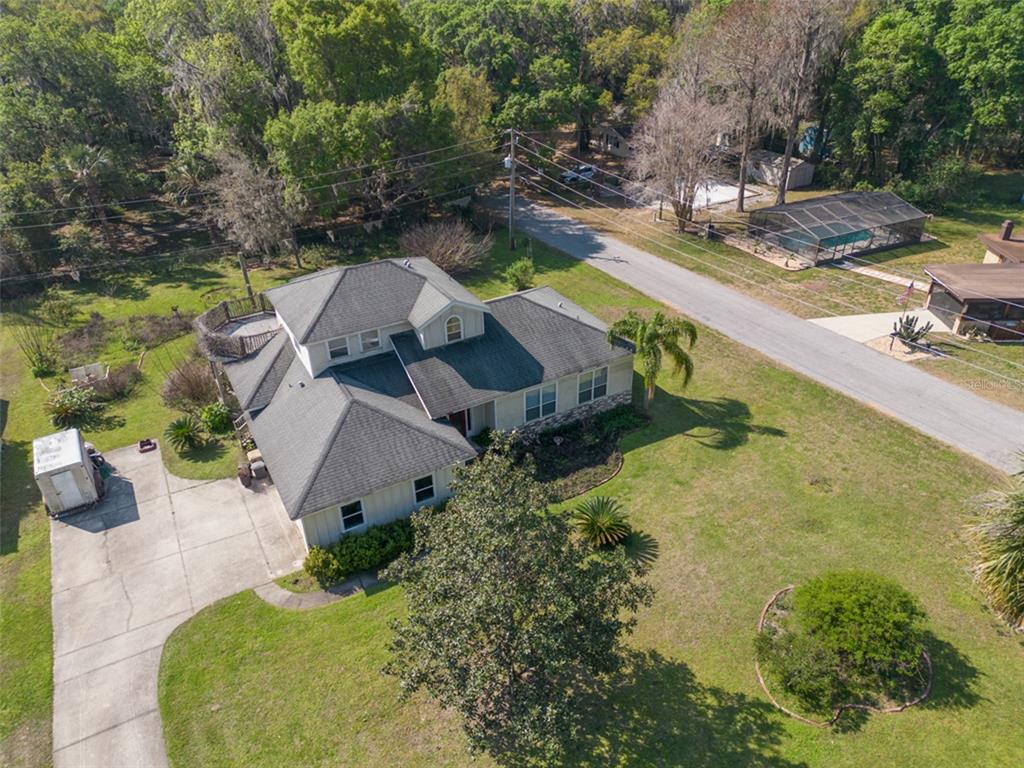 4314 Corley Island Road Leesburg, FL 34748 - Photo 1 of 1 an aerial view of a house with a swimming pool