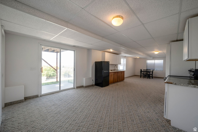 11922 Bluff View Drive Sandy, UT 84092 - Photo 21 of 30 Living area with a drop ceiling and light carpet