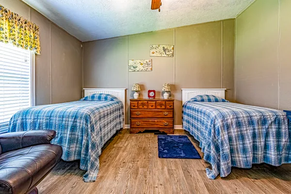 a bedroom with a bed and window