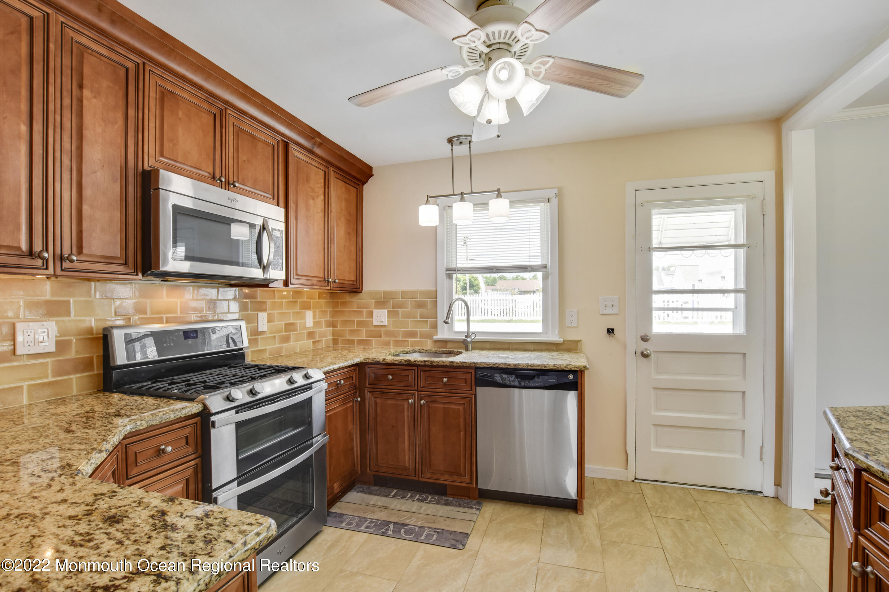 3301 B River Road Point Pleasant, NJ 08742 - Photo 7 of 20 a kitchen with stainless steel appliances granite countertop a stove and a microwave
