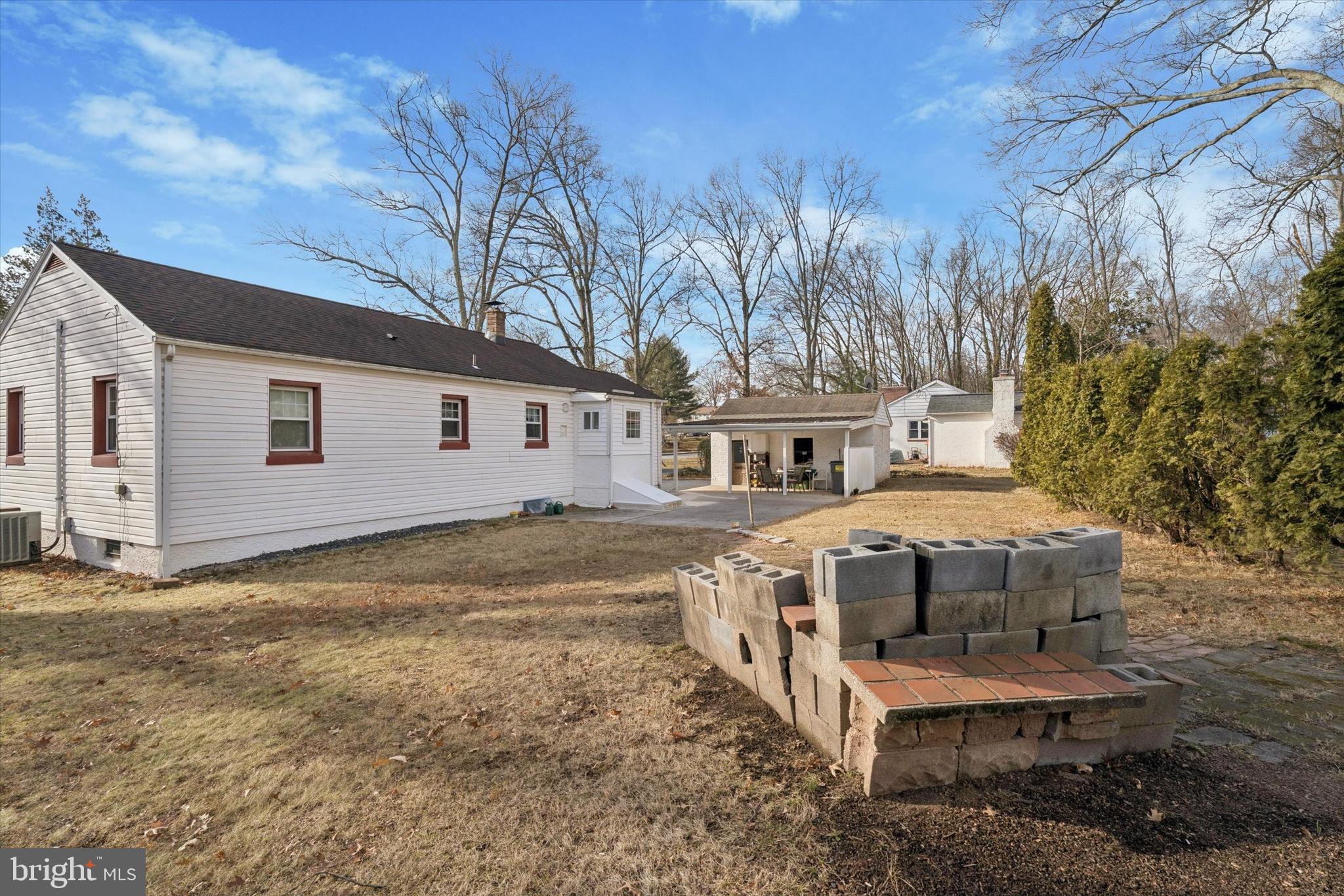507 Park Road Spring City, PA 19475 - Photo 14 of 15 a view of a white house with a big yard and large tree