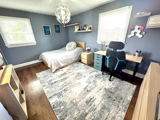 a bedroom with furniture and a window