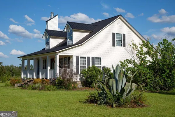 a house view with a garden space