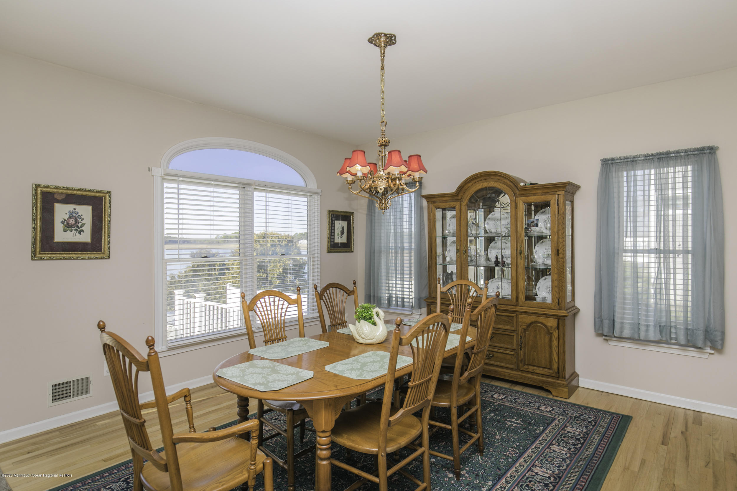 60 Seagoin Road Brick, NJ 08723 - Photo 19 of 53 a dining room with furniture a chandelier and wooden floor