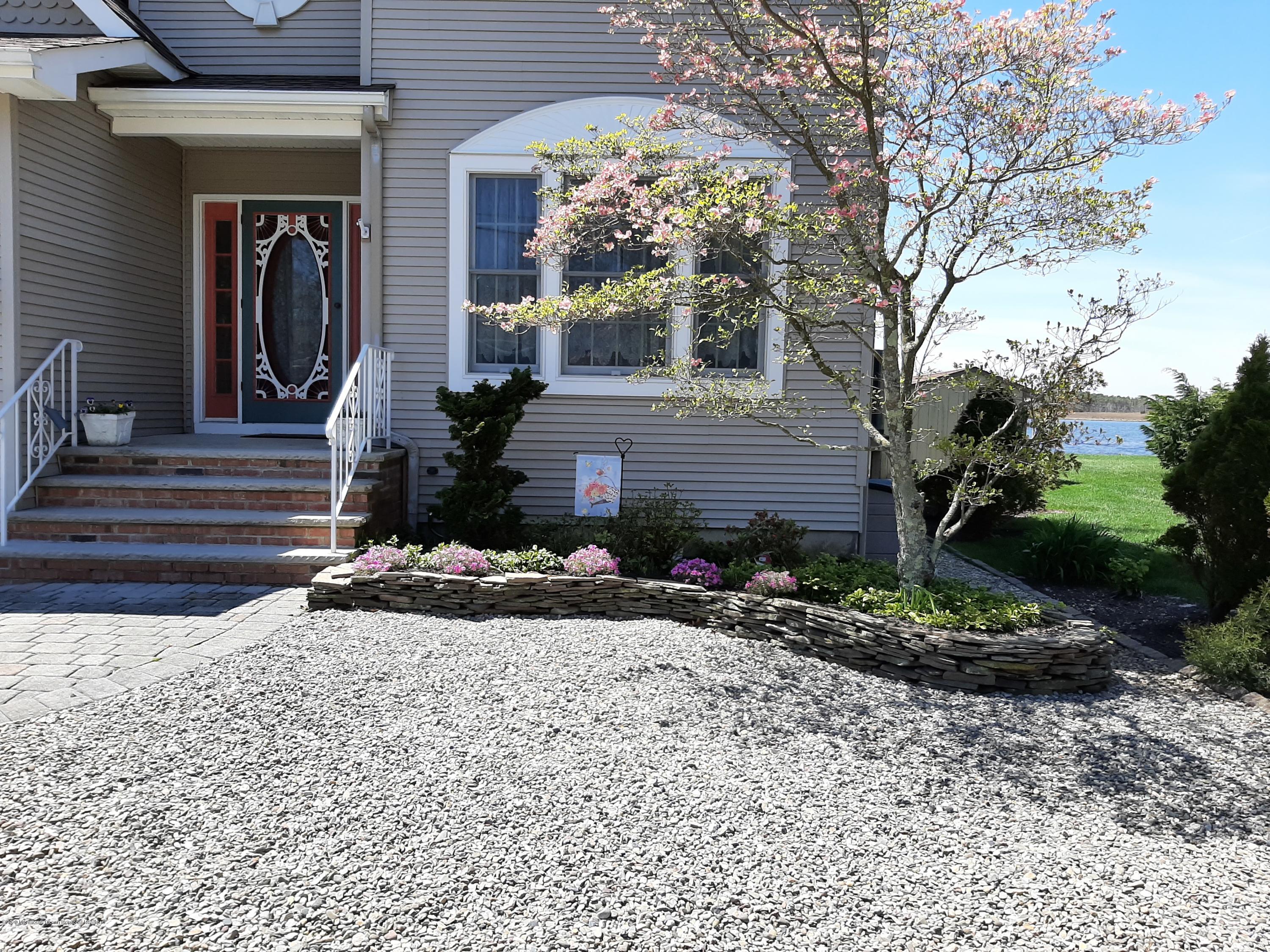 60 Seagoin Road Brick, NJ 08723 - Photo 3 of 53 a front view of a house with a yard