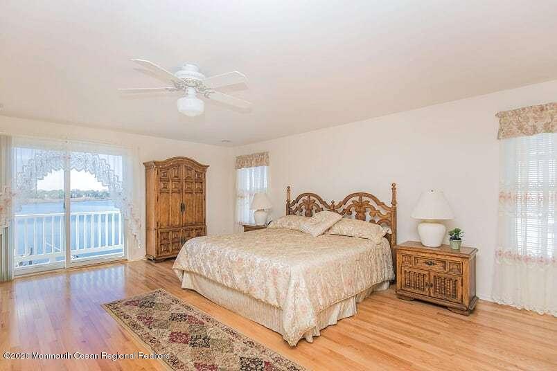 60 Seagoin Road Brick, NJ 08723 - Photo 32 of 53 a bedroom with a bed and wooden floor