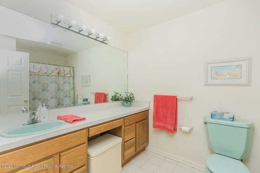 60 Seagoin Road Brick, NJ 08723 - Photo 47 of 53 a bathroom with a sink vanity mirror and toilet