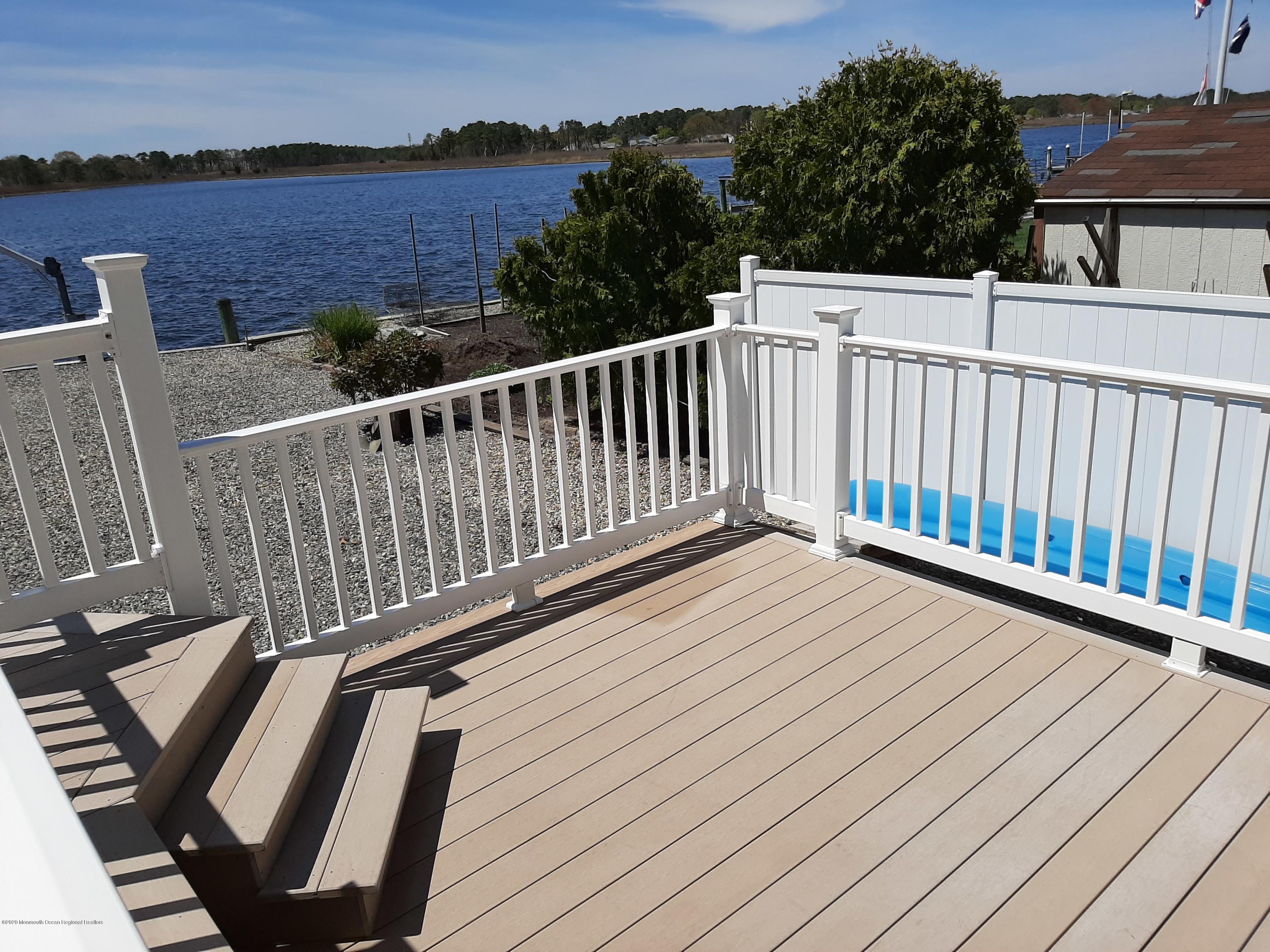 60 Seagoin Road Brick, NJ 08723 - Photo 5 of 53 a balcony with wooden floor