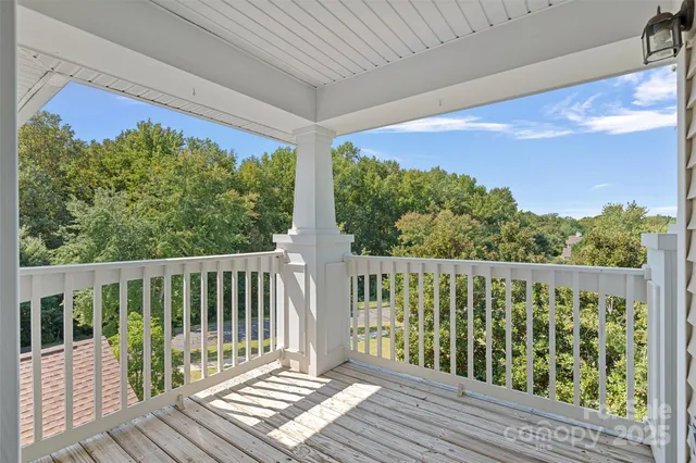 a view of a two chairs in the balcony