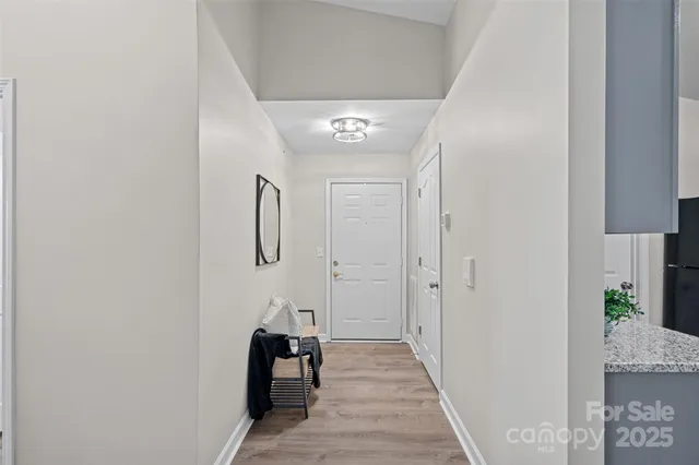 a hallway with view of living room