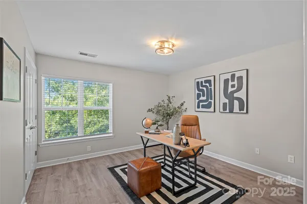 a workspace with furniture and a window