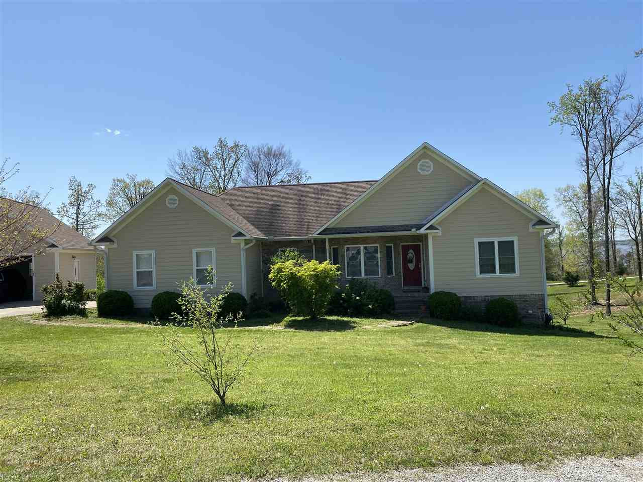 60 Overlook Ridge Big Sandy, TN 38221 - Photo 1 of 1 a front view of house with yard and green space