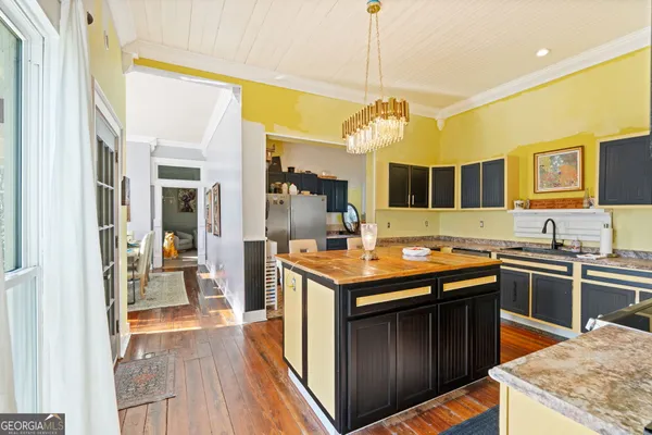 a kitchen with stainless steel appliances granite countertop a stove and a sink