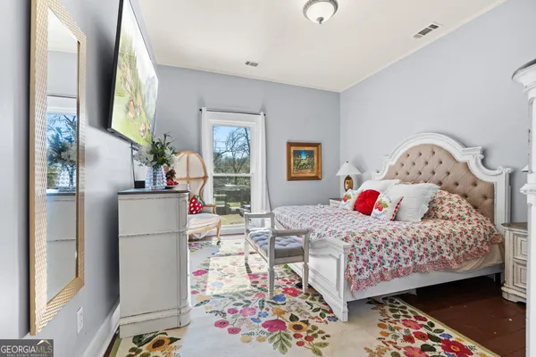 a bedroom that has a bed and a table in it