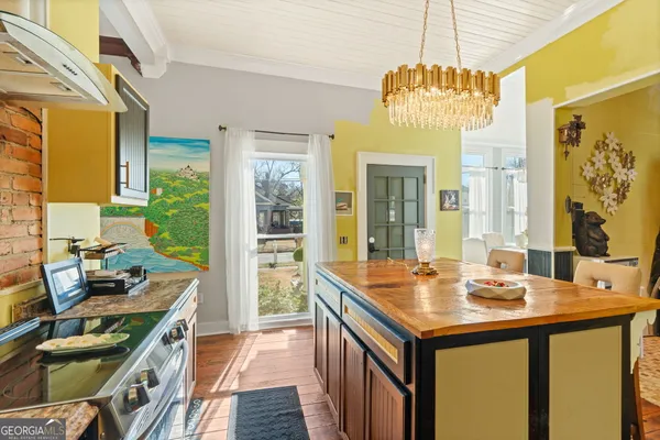 a kitchen with a sink and a stove