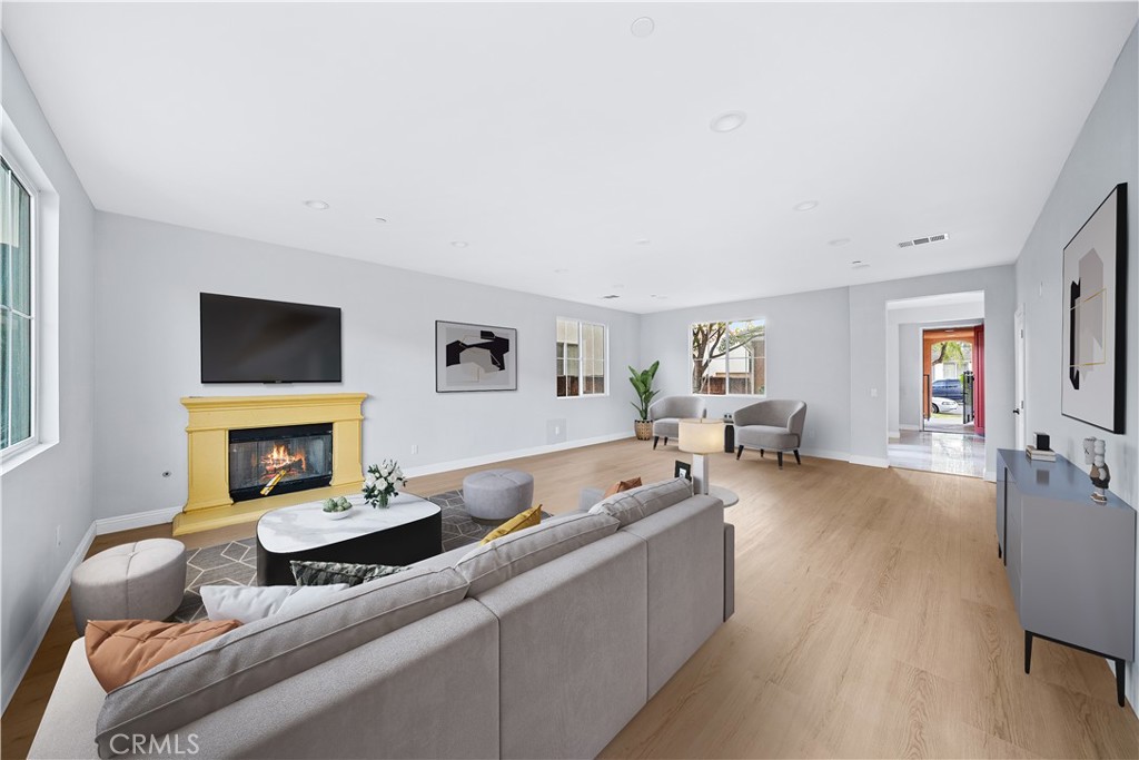 10877 Cameron Court Corona, CA 92883 - Photo 15 of 31 a living room with furniture and a fireplace