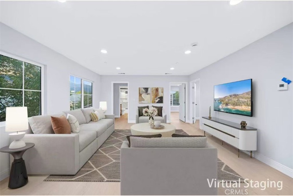 10877 Cameron Court Corona, CA 92883 - Photo 21 of 31 a living room with furniture and a flat screen tv