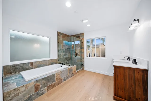 a bathroom with a tub and shower