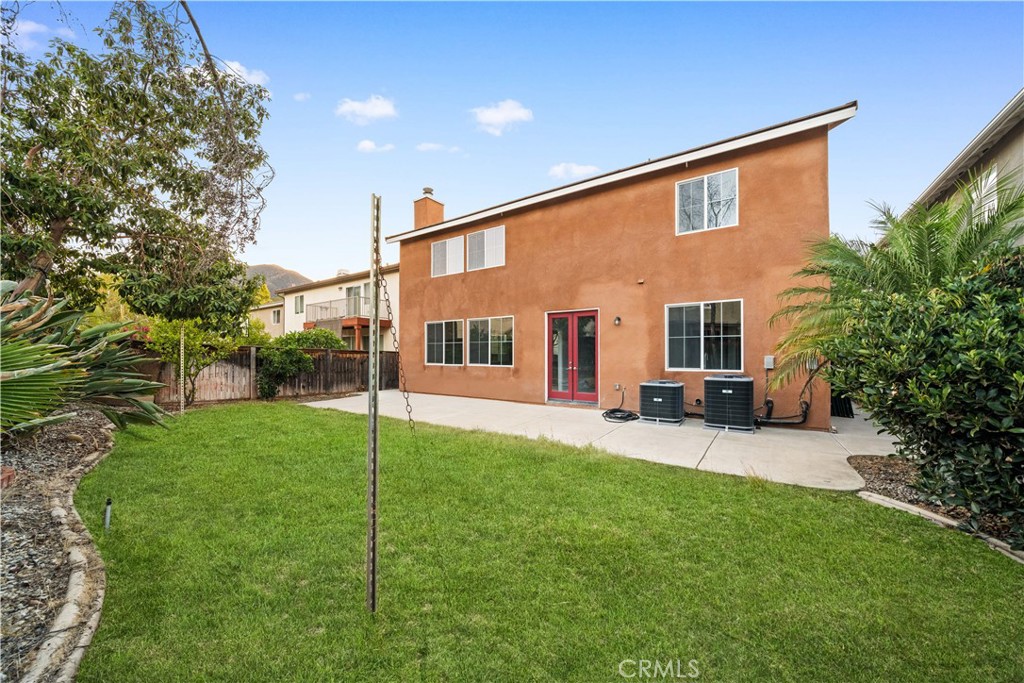 10877 Cameron Court Corona, CA 92883 - Photo 24 of 31 a view of a house with a backyard