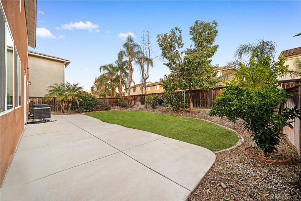 10877 Cameron Court Corona, CA 92883 - Photo 25 of 31 a view of a garden with a building in the background