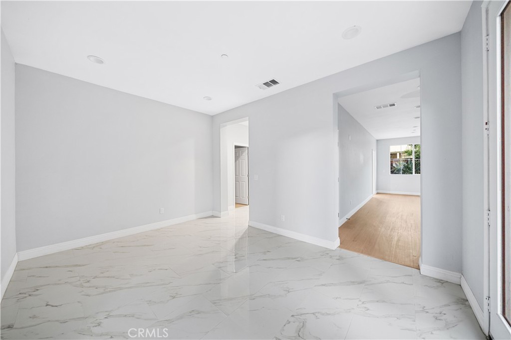 10877 Cameron Court Corona, CA 92883 - Photo 4 of 31 an empty room with windows