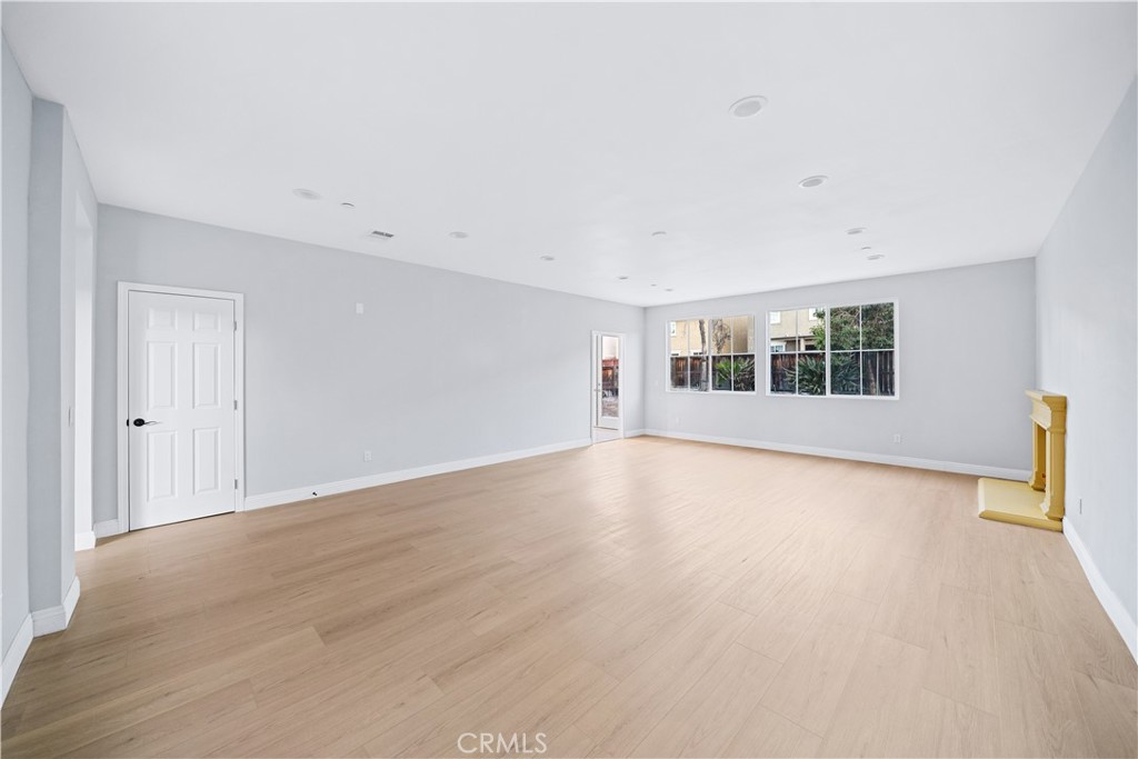 10877 Cameron Court Corona, CA 92883 - Photo 8 of 31 a view of an empty room with a window