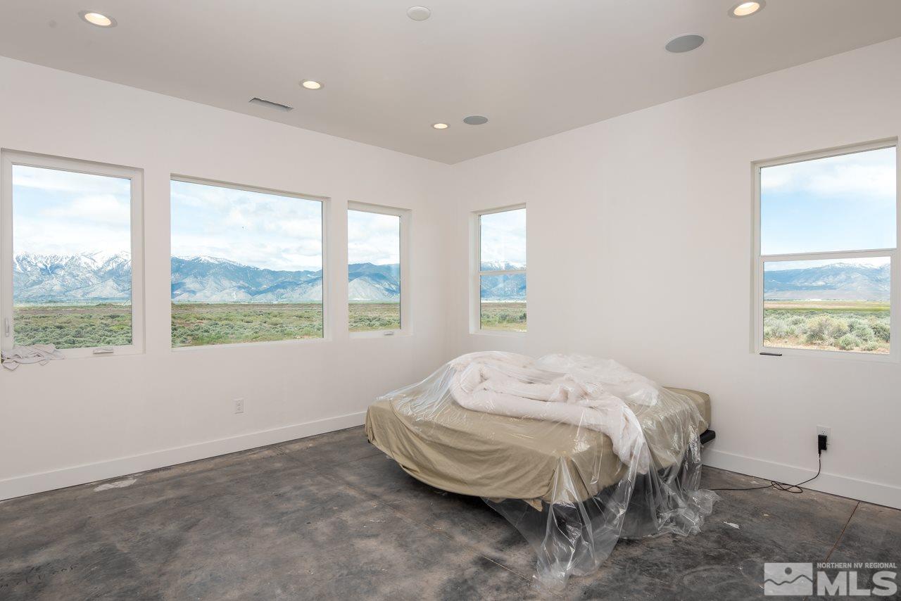 2006 East Valley Road Minden, NV 89423 - Photo 13 of 25 a bed sitting in a bedroom next to a window
