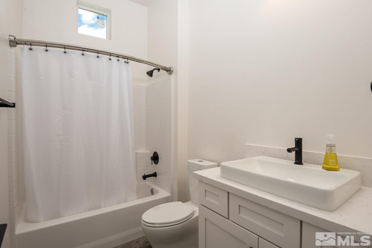 2006 East Valley Road Minden, NV 89423 - Photo 20 of 25 a bathroom with a sink a toilet and shower