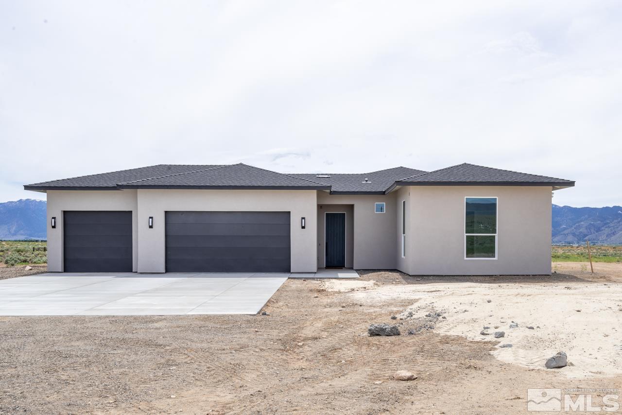 2006 East Valley Road Minden, NV 89423 - Photo 3 of 25 a front view of a house with a yard and garage