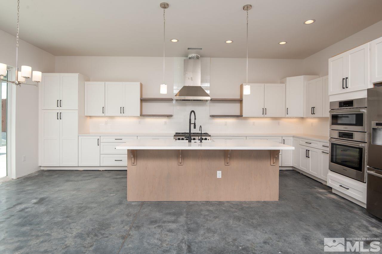 2006 East Valley Road Minden, NV 89423 - Photo 4 of 25 a kitchen with a sink stainless steel appliances and cabinets