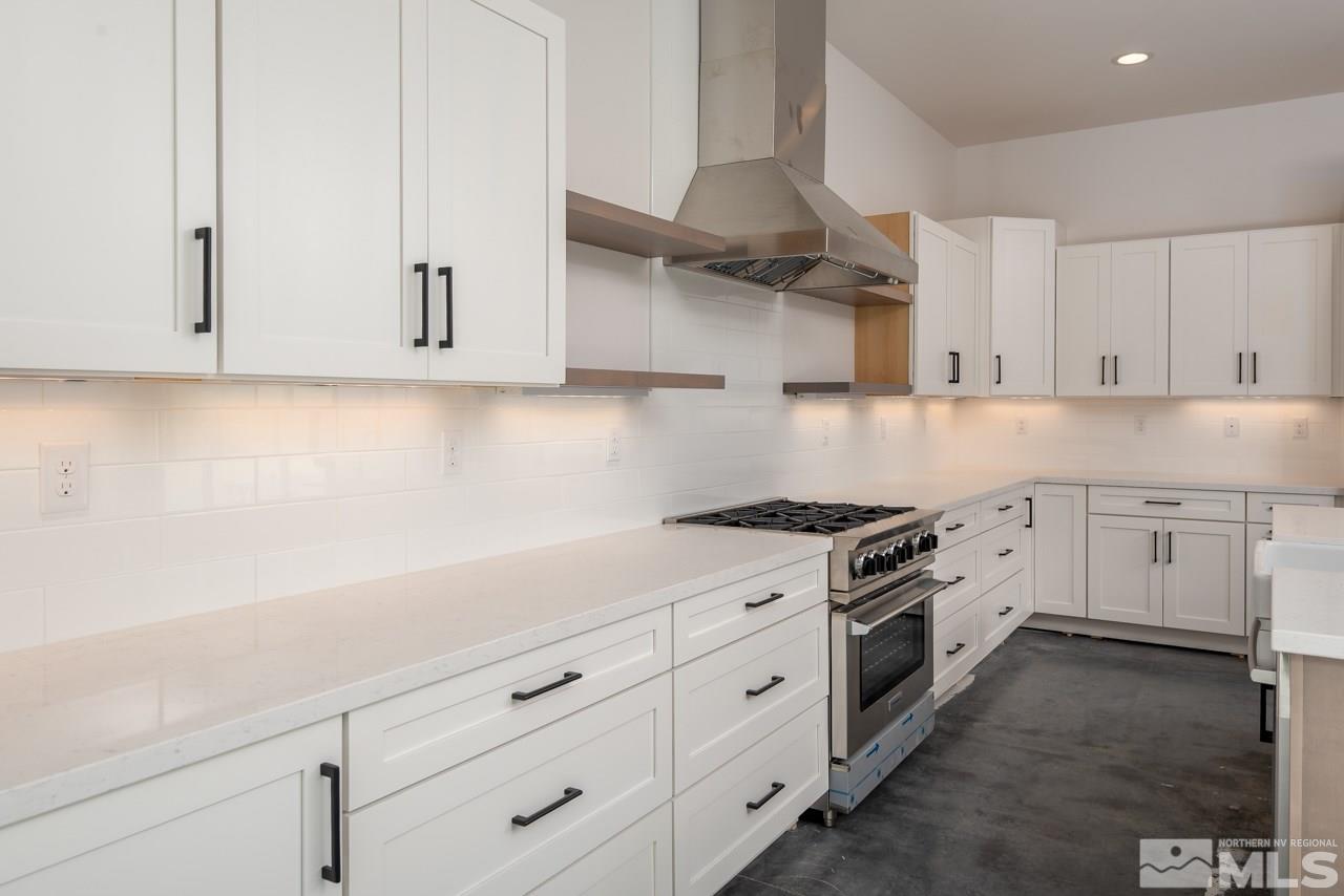 2006 East Valley Road Minden, NV 89423 - Photo 6 of 25 a kitchen with white cabinets and white appliances
