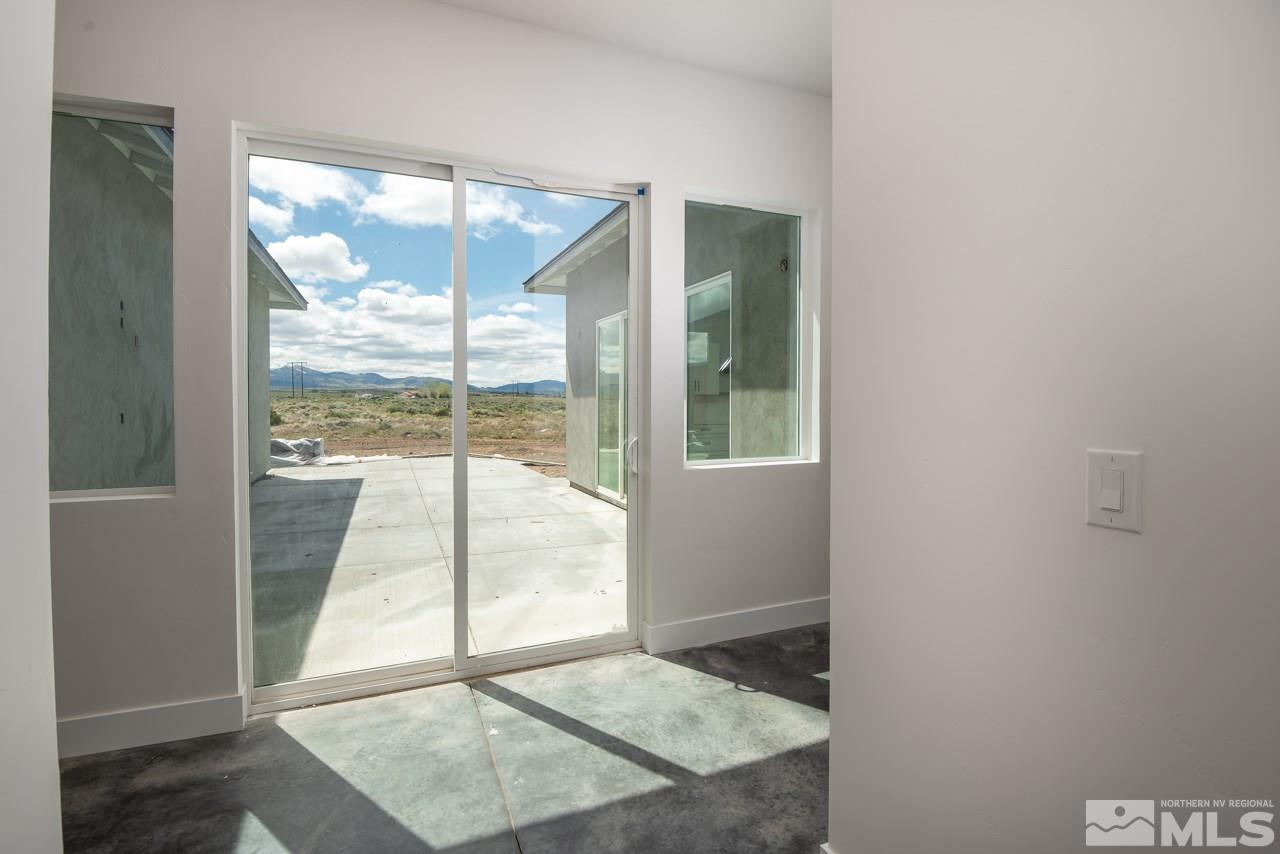 2006 East Valley Road Minden, NV 89423 - Photo 9 of 25 an empty room with wooden floor and a window